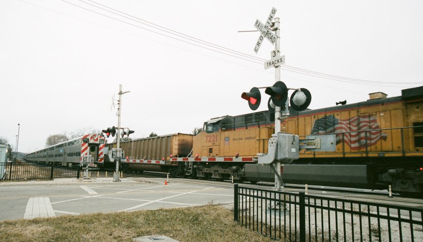 METRA and freight train crossing a set of tracks